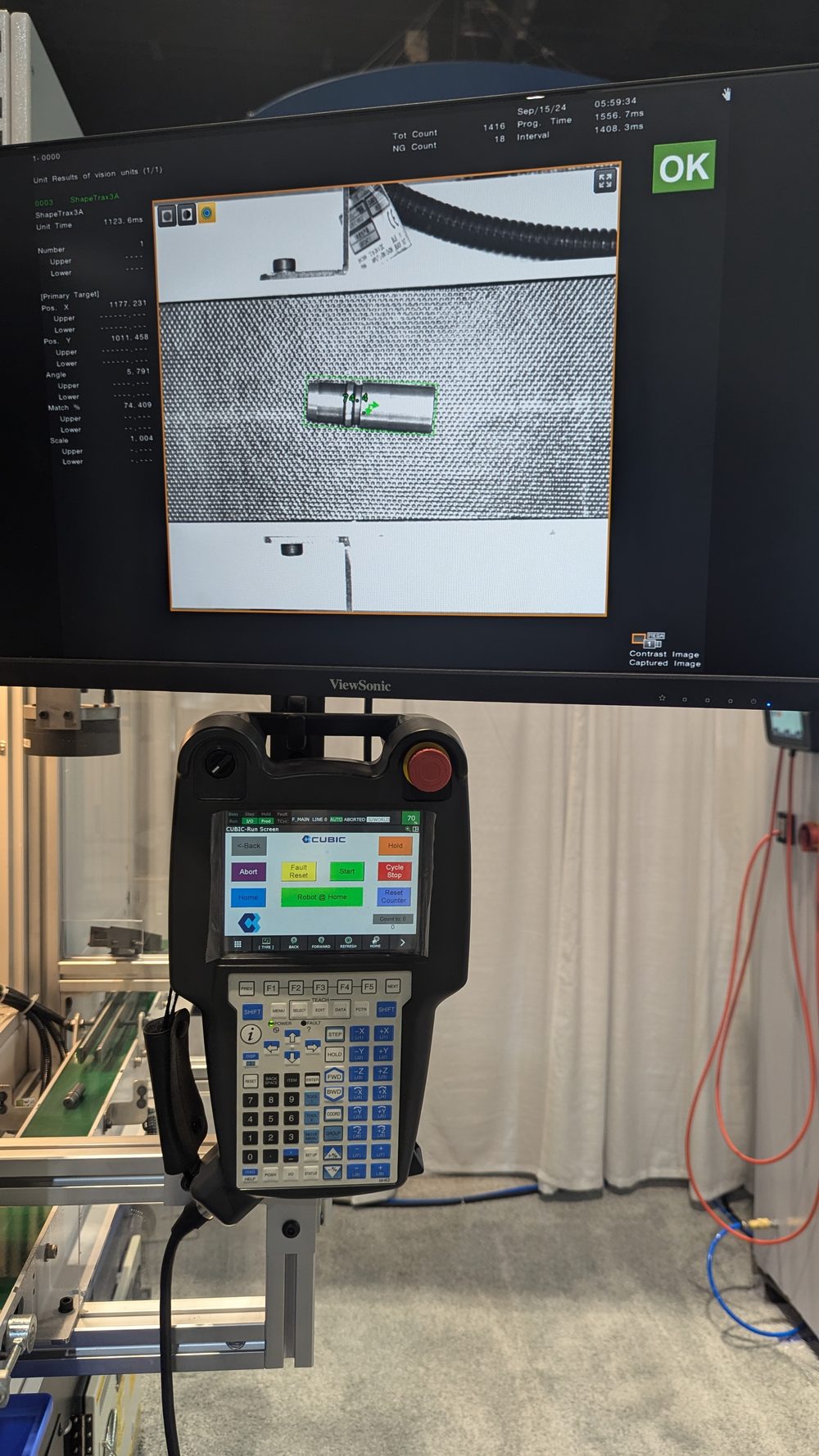 FANUC teach pendant showing a custom run screen with Abort, Fault Reset, Start, Cycle Stop, Home, Robot at Home and Reset Counter buttons, beneath a monitor displaying a passing vision inspection result